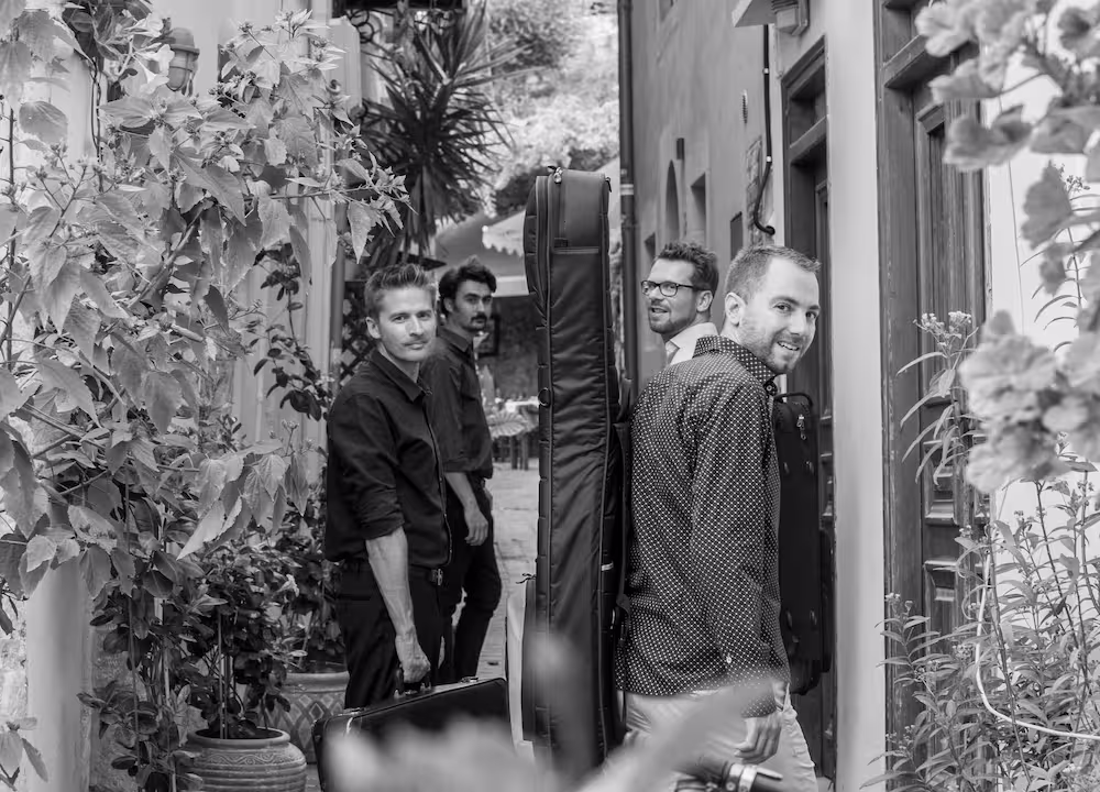 Lefteris, Matthieu, Stefan and Vasilis walking with gear.