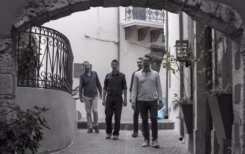 Lefteris, Matthieu, Stefan and Vasilis under arch.